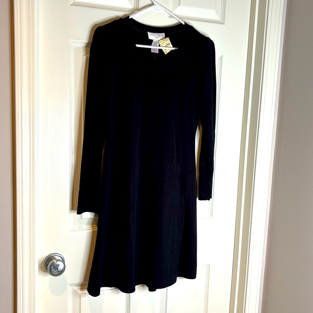 Little black cocktail dress. Dressy or casual. 92% acetate 8% Lycra made in USA